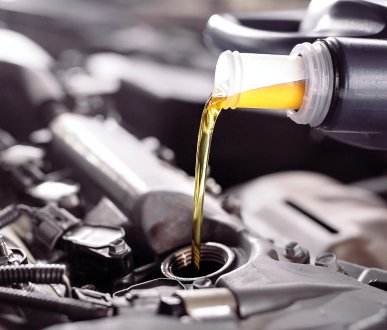 Oil Changing, Pouring in New Oil