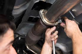 Mechanic Repairing Exhaust
